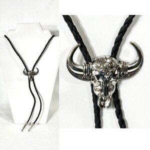 Silver-tone and black cord bolo tie.